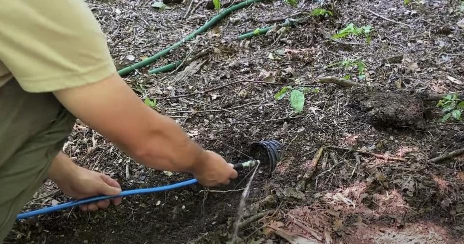 Man cleaning weeping tile